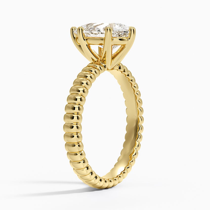 Petra Textured Solitaire Ring - Pear Center Stone